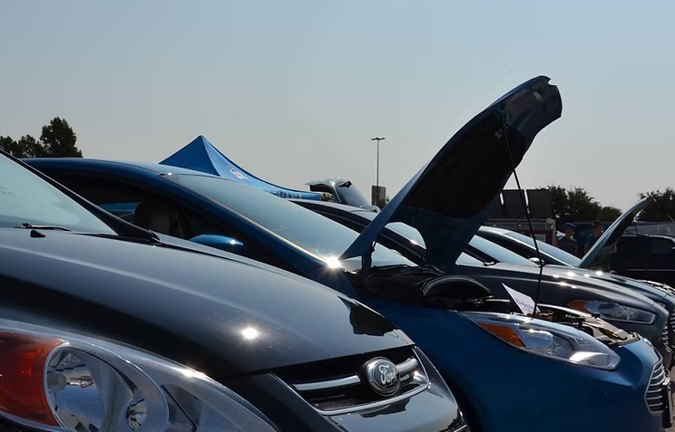 Electric vehicles with their hoods open